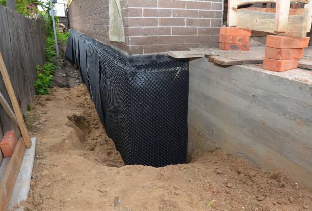 Happy homeowners after waterproofing job in Arkport